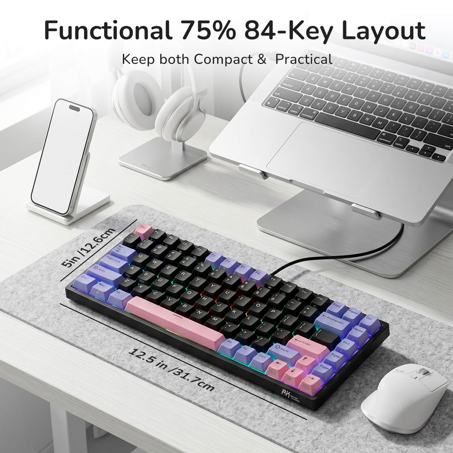 75% keyboard with colorful keycaps on a desk with laptop and phone